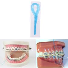This orthodontic tool makes it a lot easier to get between the tight spaces of your teeth. 35pcs Set Floss Threaders Tooth Floss Holders Between Orthodontic Braces Bridge Dental Plaque Removal Effortless High Quality Dental Flosser Aliexpress