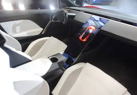 Well, the tesla roadster has almost all of those aspects covered. File Inside The New Tesla Roadster Jpg Wikimedia Commons