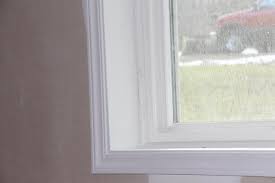 Once the beads are cut to length, spray the drywall and the underside of the corner bead's mud legs with 847 spray adhesive. Holmes Basement How We Trim Around Windows