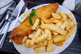 The fried catfish—and plenty of it—is usually served as a complete dinner with slaw, hush puppies, and french fries. Fish And Chips Wikipedia