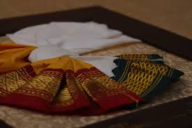 Click to see our best video content. South Indian Traditional Wedding Invitation That Depicts Saree And Dhoti That Wea Traditional Wedding Invitations Wedding Dress Invitations Hindu Wedding Cards