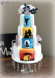 Hidden Disney Theme On The Back Of An Elegant 4 Tier Wedding Cake Airbrushed Then Silhouettes Wer Disney Wedding Cake 4 Tier Wedding Cake Themed Wedding Cakes