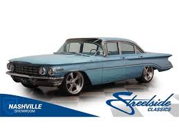 Image result for Turquoise 1960 Oldsmobile