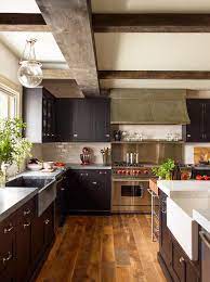 Dark cabinets don't have to be black—if the midnight mood isn't for you, consider a lighter shade of brown. Black Kitchen Cabinets With Concrete Countertops Transitional Kitchen