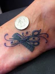 Very nice traditional scissor with red flowers and hair comb tattoo on thigh. Tattoos By Wojo Itty Bitty Foot Tattoo Hairdresser Tattoos Cosmetology Tattoos Tattoos