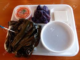 The purple sweet potato goes by a few names, and there are two common varieties. Hawaiian Lau Lau Plate Served With Fresh Day Old Poi In Bowl Uala Sweet Potato Haupia With Lomi Salmon In A Plastic Container On A Styrofoam Plate On A Table Stock Photo Picture