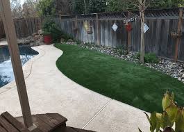 A swath of green extending around your pool can give you a softer and more organic look for your outdoor living space while providing you. Enhance Your Pool Experience With Synthetic Grass For Pets In Tracy