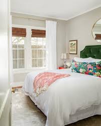 Nightstands are considered an important part of a bedroom. Red And Green Bedroom With Round Gold Mirror Over Bed Transitional Bedroom