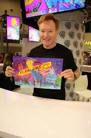 Watch Conan O Brien Can T Stop Online Free Comedy Icon Conan O Brien Proudly Displays A Poster Of The Flaming C The Outrageous Animated Superhero That He Inspired During Conan O Brien Conan Comic Con