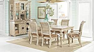 It has tasteful aesthetics that combine well with its classy structural design. Cindy Crawford Home Key West Sand 5 Pc Rectangle Dining Room With Slat Chairs From Furniture Rooms To Go Furniture Formal Dining Room Sets Dining Room Suites