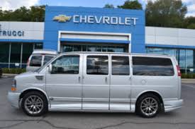 Conversion style van with mood lights, window shades, automatic convertible back seat, 4 captain chair style interior and cruise control. Used Vans Mike Castrucci Conversion Van Land