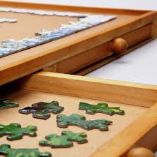 This is a great way to make puzzles portable. Amazon Com Bits And Pieces The Original Jumbo 1500 Pc Wooden Puzzle Plateau Smooth Fiberboard Work Surface Four Sliding Drawers Complete This Puzzle Storage System Toys Games
