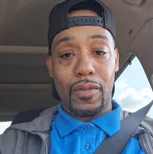 Odell Beckham (senior) and Shaquille O'Neal talking with two young ladies 