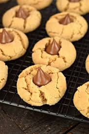 The chocolate will soften on the warm cookie and then harden up again after the cookie cools. Peanut Butter Blossoms Cookie Recipe Shugary Sweets