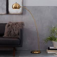 It has a study but small and sleek base and a step and shade made of metal, with an elegant golden finish. The Many Stylish Forms Of The Modern Arc Floor Lamp