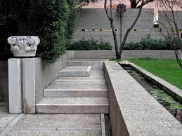Evergreen shrubs lining up the concrete garden steps make a good ornamental boundary. 40 Ideas Of How To Design Exterior Stairways