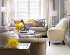 A tufted butterscotch sofa brings out the yellow tones in the chevron window treatments. 31 Grey Lemon Ideas Grey And Yellow Living Room Decor Living Room Grey