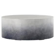Solid wood coffee tables are a classic addition that never go out of style, and this option from ashley furniture is beautiful, spacious, and timeless. Erin Industrial Loft Solid Round Indigo Ombre Concrete Outdoor Coffee Table 41 W 50 W Kathy Kuo Home