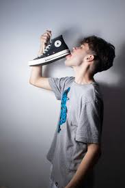 Man in T-shirt Licking Shoe · Free Stock Photo