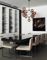 Chandelier lighting also hangs from the ceiling but features a branched system with many lights as opposed to one light like pendants. 10 Modern Globe Chandeliers And Pendant Lights