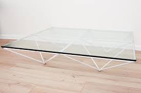 Unique inverted pyramids and the clarity of glass open up the space whilst providing visual impact. Paolo Piva Alanda Pyramid Coffee Table 1980 Mutualart