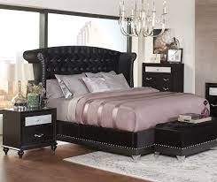 Metallic leatherette upholstery on head and footboards or black velvet bed featuring a winged headboard with nailhead trim. Barzini Black Velvet Upholstered Bed By Coaster 300643q