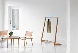 This minimalist coat rack is made of concrete and wood. Nikari Skandinavia Coat Rack Oak Finnish Design Shop