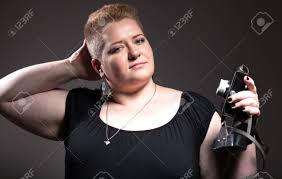 If you have thick wavy hair, consider this cut to refresh your texture. Chubby Woman With Short Hair Taking Pictures Of Old Camera Herself Stock Photo Picture And Royalty Free Image Image 24145712