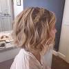 This bohemian hairstyle is best suited for women with medium to long hair and without short layers because they'll stick out of the braid. 1