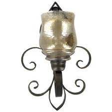 Create a rustic home that is illuminated with gentle and flickering light with round cage metal wall sconce. Dark Bronze Fleur De Lis Metal Wall Sconce Hobby Lobby 248286