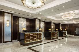 Why are midscale hotels constantly changing brands? Hilton Hotel Goddard Littlefair Archello