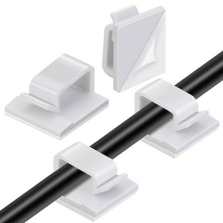 White adhesive cable clips holding a black cable along a surface