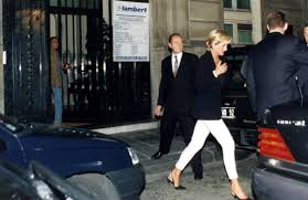 Diana, Princess of Wales and Dodi Al Fayed exiting from the back door of  The Ritz Hotel in Paris, and getting into the black Mercedes at 12:20 am,  with bodyguards Trevor Rees-Jones