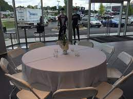 White Hercules Chairs And 60 Round Tables At The Jim Ellis Audi Atlanta Showroom Party Event Ren Pool Lounge Chairs Wooden Lawn Chairs Table Linen Rentals