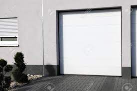 Modern steel™ garage doors are available with a wide variety of options to suit your taste and your home's appearance. Modern White Garage Door Sectional Door Stock Photo Picture And Royalty Free Image Image 98439844