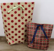 * get a box from the pantry (i used a rice box) * wrap the paper around the box like you're wrapping a gift * use glue stick to stick edges of paper together and a piece of tape to secure bottom of bag * cut a piece of cardboard a bit smaller than bottom of bag. How To Make A Gift Bag Out Of Wrapping Paper 8 Ways Guide Patterns