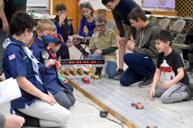 Carving out memories: Local scouts compete in annual Pinewood Derby