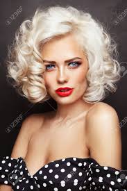 Gargoyles, #goth girl and darkness. Vintage Style Portrait Of Young Beautiful Blonde Pin Up Girl With Curly Hair And Red Lips Over Grunge Background Stock Photo Picture And Royalty Free Image Image 64160013