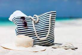 Straw Hat Bag Sun Glasses And Flip Flops On A Tropical Beach Straw Hat Bags Beach