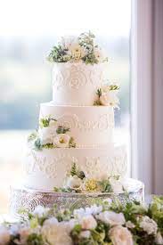Tiered Wedding Cakes Evolved Through A Medieval Kissing Game Cool Wedding Cakes Floral Wedding Cakes Wedding Cake Flavors