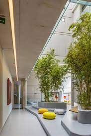Gallery Of Eurogida Factory Administrative Building Oney Architecture 7 Interior Garden Architecture Outdoor Seating Areas