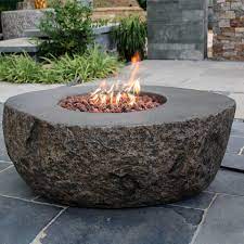 Concrete fire pit with propane tank inside. Boulder Fire Pit