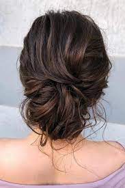 The bun is becoming an increasingly popular wedding hairstyle for little girls and is a great way to keep hair tidy and out of the way, for a wedding this is ideal! Bohemian Wedding Hairstyles Elegant And Messy Low Bun On Medium Brown Hair Veronika Belyanko Longhairstyle Hair Styles Medium Hair Styles Elegant Wedding Hair