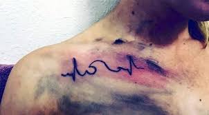With passing time, most people are getting tattoos done. Dark Black Ink Heart Rhythm Shoulder Tattoo With Wave Tattooimages Biz