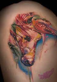 He trained and developed a greater interest in tattooing at a local omaha tattoo shop. Patrick Oleson Best Tattoo Omaha Watercolor Style Horse Green Fox Tattoo
