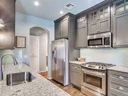 Lighter elements come on top of it with white paneled cabinets, stainless steel appliances and chrome finished hardware. 23 Small Galley Kitchens Design Ideas Designing Idea