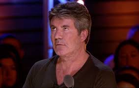 X Factor's Simon Cowell stunned as singer defies him by REFUSING to split  from his group and go solo