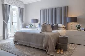 Our Master Bedroom Design Features A Beautiful Tall Paneled Headboard In Grey Picking Up The Sof In 2020 Bedroom Styles Master Bedroom Design Bedroom Design