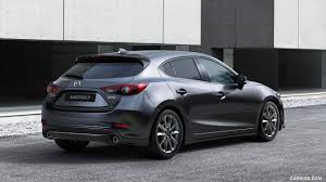 To begin with, first impressions are of a car that isn't that sporty. 2017 Mazda 3 5 Door Hatchback Color Machine Grey Rear Three Quarter Mazda 3 Hatchback Mazda Hatchback Mazda 3