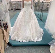 Beautiful ivory ballroom gown with full tulle skirt and flower appliqué at waist. Oleg Cassini Wedding Ball Gown With Lace Appliques David S Bridal Ball Gowns Wedding Ball Gowns Classic Wedding Dress